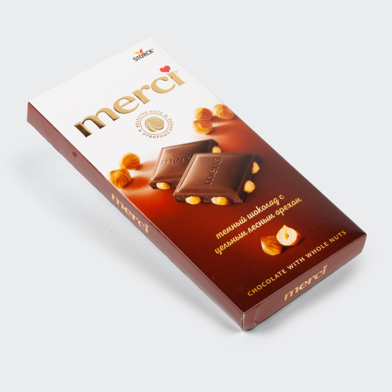 Темный шоколад с цельным лесным орехом merci